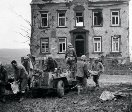 Medics hauling wounded soldiers.