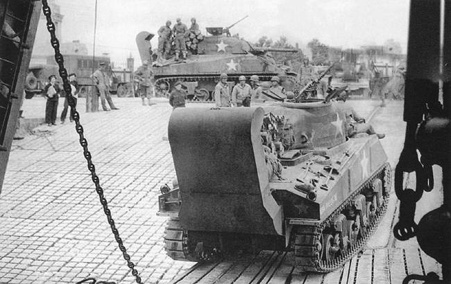 Shermans on landing craft for Normandy.